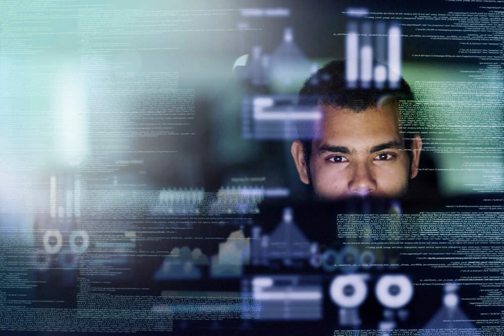 Cropped shot of a young computer programmer looking through data