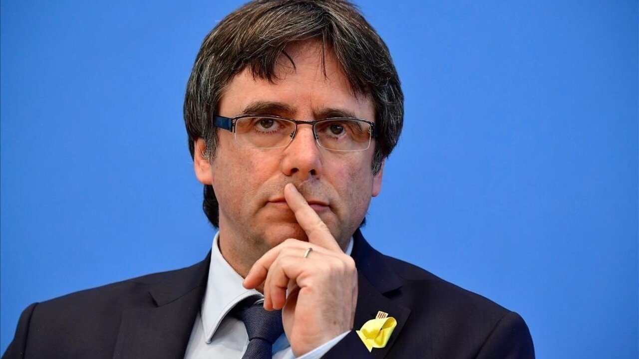 Catalonia s deposed president Carles Puigdemont gives a press conference on July 25  2018 in Berlin  Catalonia s deposed president Carles Puigdemont  who has been in Germany for four months  said he will return to Belgium after a Spanish judge dropped a European arrest warrant for him    AFP PHOTO   Tobias SCHWARZ