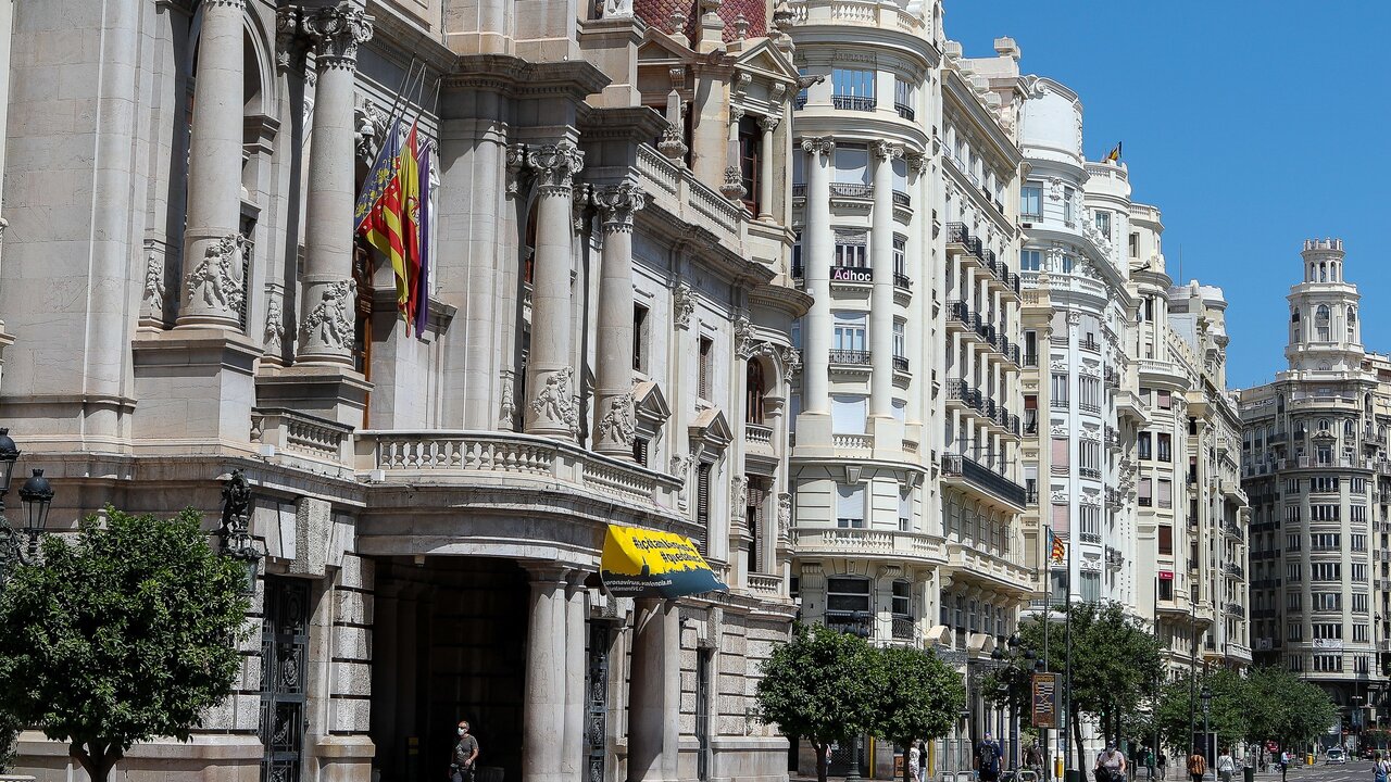 Illustration, Valencia city hall facade with flags at half-mast after declaring 10-day national mourning during the eleventh week after the Government declared the state of alarm in Spain and recommended people to stay at home to fight coronavirus COVID-19 on May 28, 2020 in Valencia, Spain