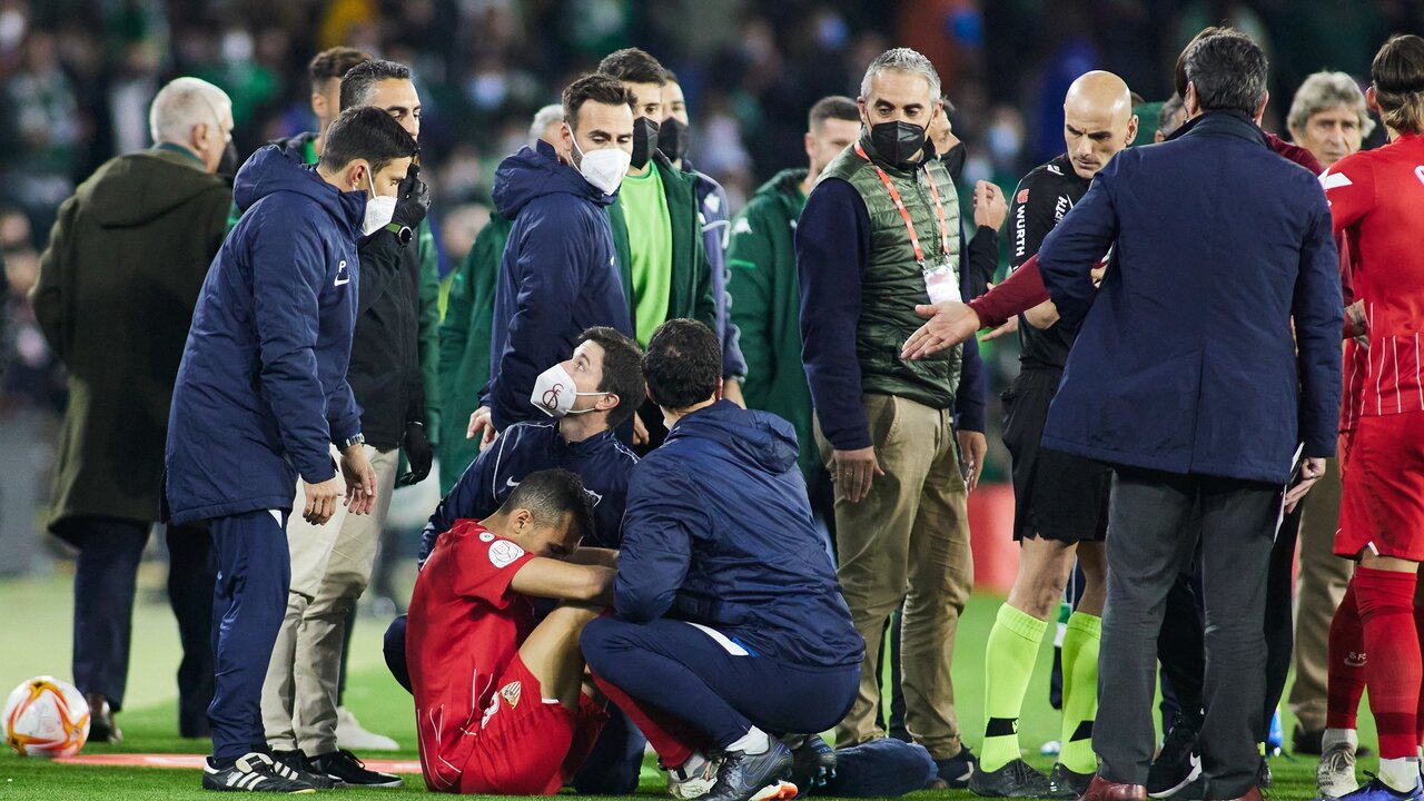Joan Jordan of Sevilla hurts after a fan threw a stick during the spanish league, the round of 16 of the Copa del Rey, football match played between Real Betis and Sevilla FC at Benito Villamarin stadium on January 15, 2022, in Sevilla, Spain.