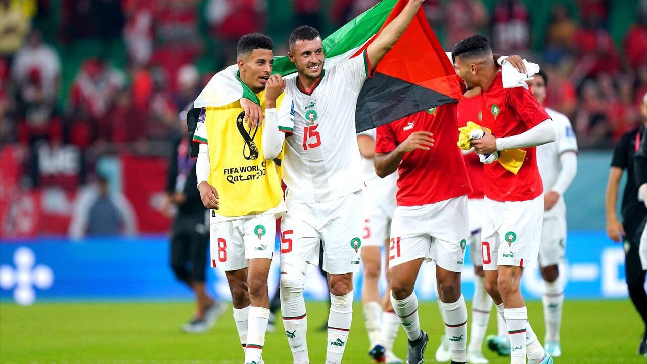 01 December 2022, Qatar, Doha: Morocco's Azzedine Ounahi (L) and Selim Amallah celebrate at the end of the FIFA World Cup Qatar 2022 Group F soccer match between Canada and Morocco at Al Thumama Stadium. Photo: Mike Egerton/PA Wire/dpa
