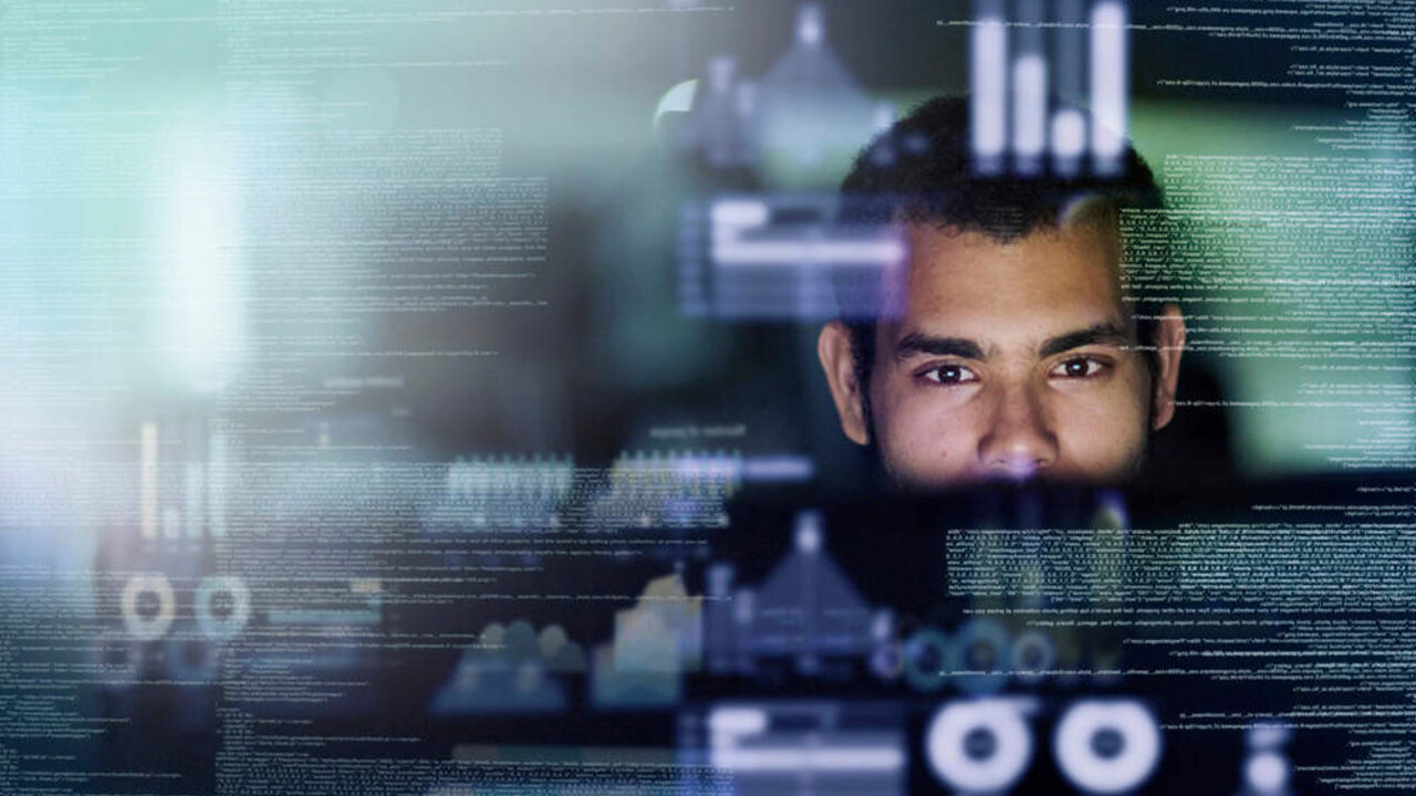 Cropped shot of a young computer programmer looking through data