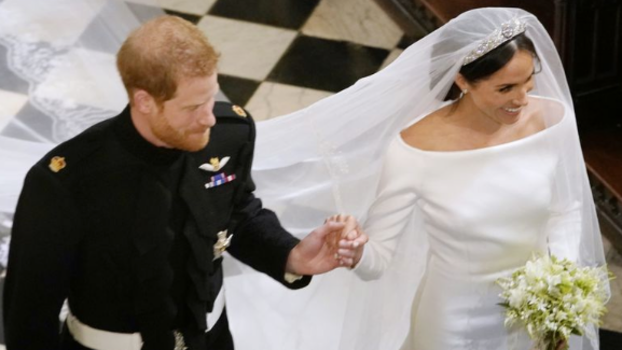 El pr&iacute;ncipe Harry y Meghan Markle en su boda