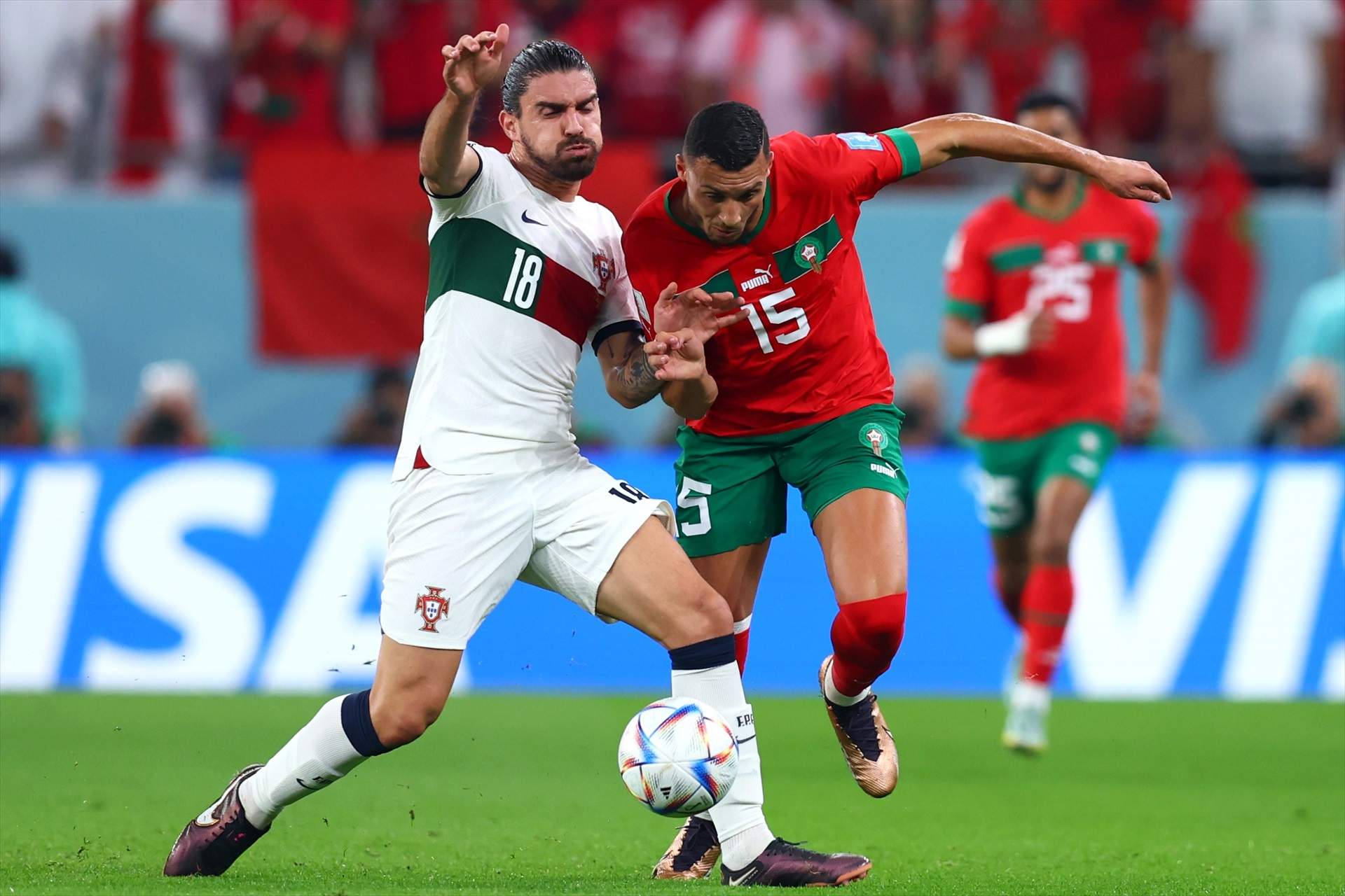 10 December 2022, Qatar, Doha: Portugal's Ruben Neves and Morocco's Selim Amallah battle for the ball during the FIFA World Cup Qatar 2022 Quarter-Final soccer match between Morocco and Portugal at Al-Thumama stadium. Photo: Tom Weller/dpa