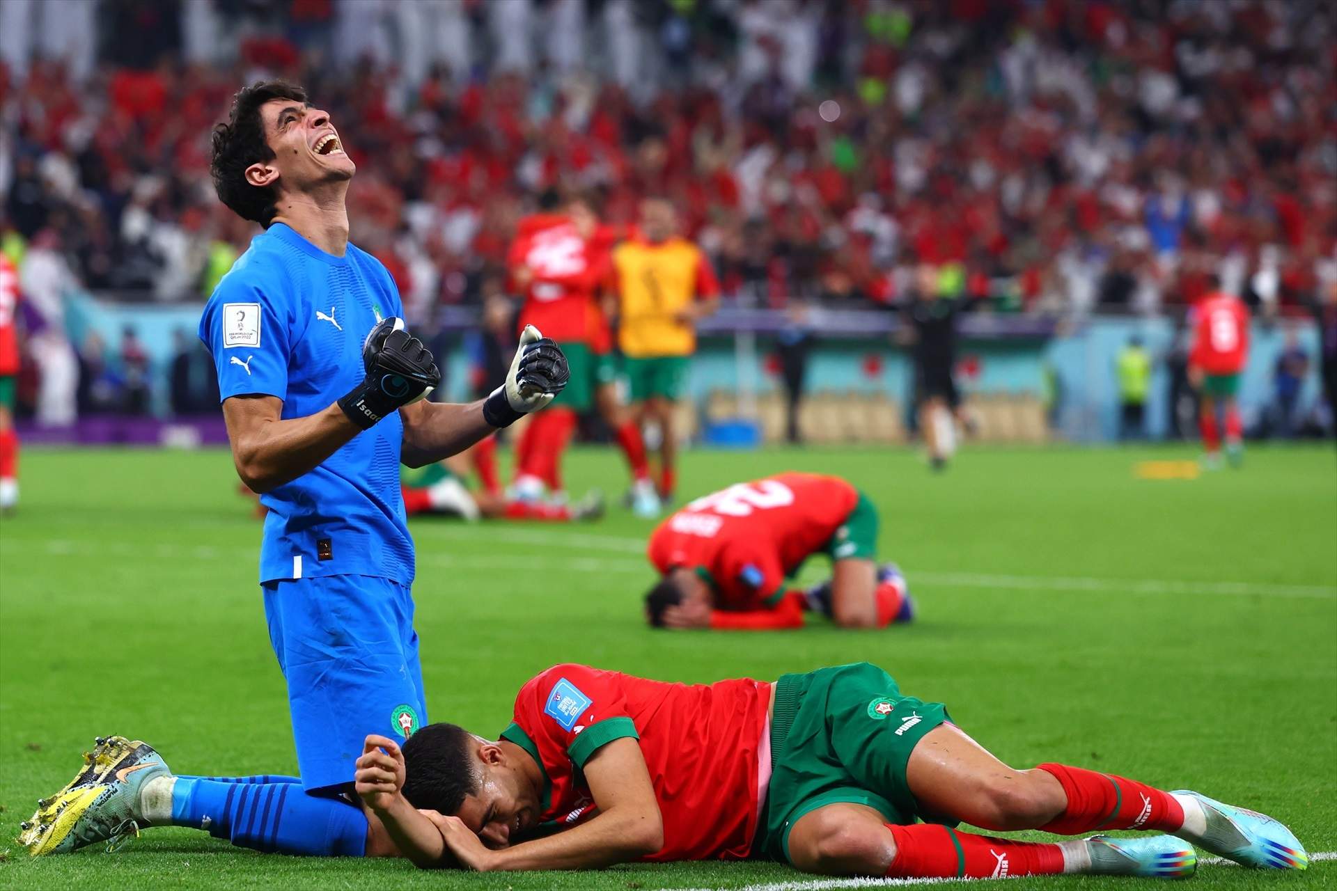 10 December 2022, Qatar, Doha: Morocco's goalkeeper Bono and teammate Achraf Hakimi celebrate their victory in the FIFA World Cup Qatar 2022 Quarter-Final soccer match between Morocco and Portugal at Al-Thumama stadium. Photo: Tom Weller/dpa