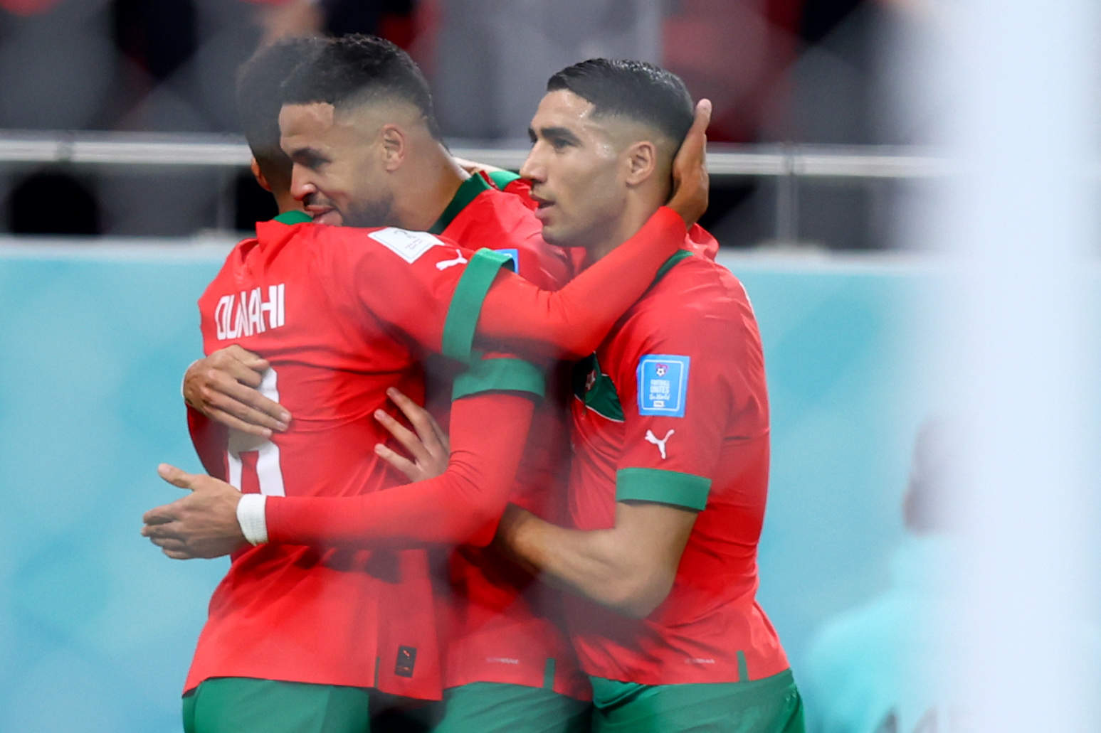 10 December 2022, Qatar, Doha: Morocco's Youssef En-Nesyri celebrates scoring his side's first goal with teammates Morocco's Achraf Hakimi (R) and Azzedine Ounahi during the FIFA World Cup Qatar 2022 Quarter-Final soccer match between Morocco and Portugal at Al-Thumama stadium. Photo: Tom Weller/dpa