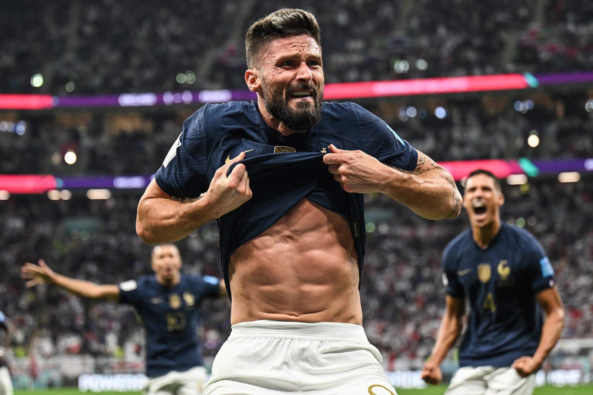 10 December 2022, Qatar, Al Khor: France's Olivier Giroud celebrates scoring his side's second goal during the FIFA World Cup Qatar 2022 Quarter-Final soccer match between England and France at the Al Bayt Stadium. Photo: Robert Michael/dpa
